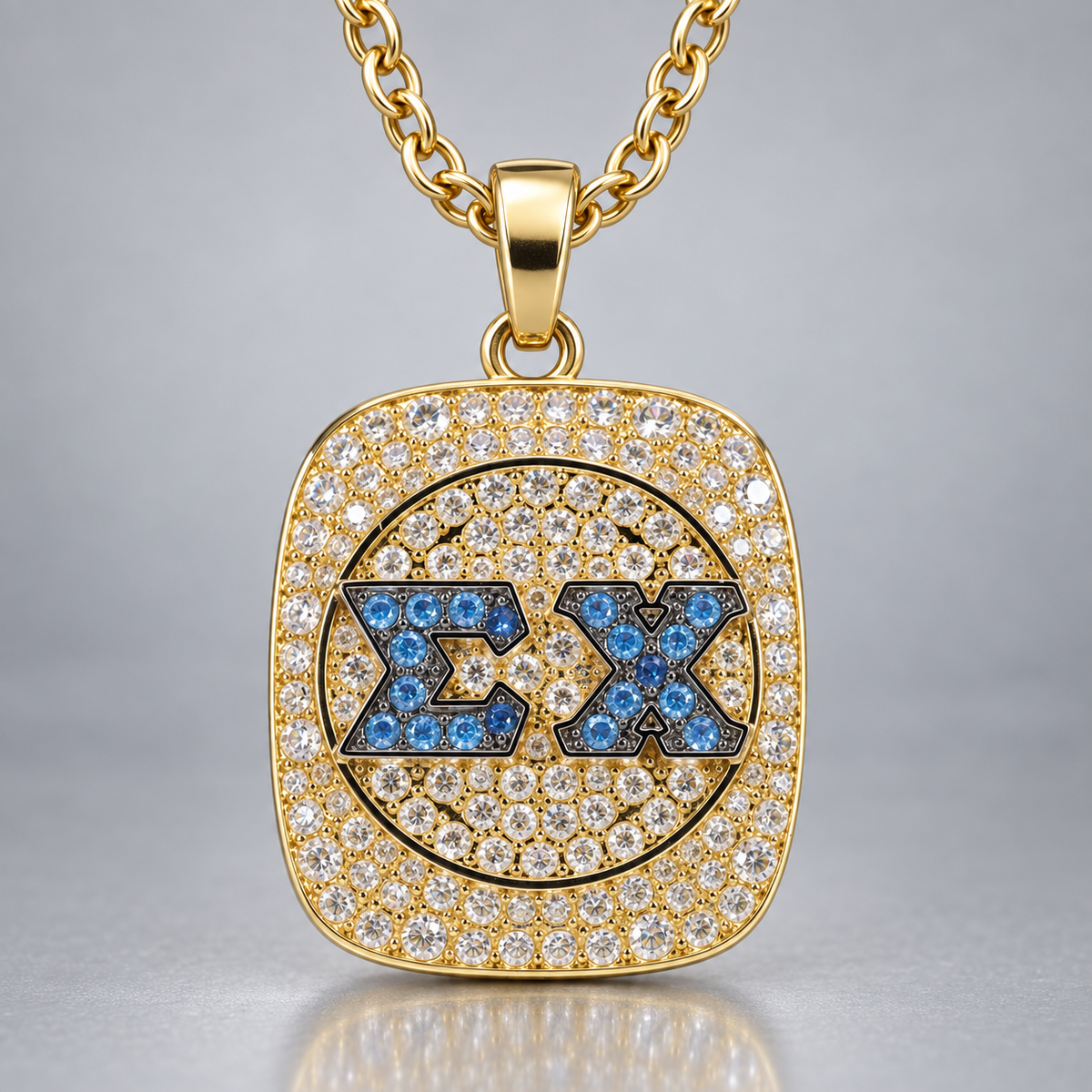 Sigma Chi gold pendant with blue ΣΧ stones, clear pavé face and matching gold chain